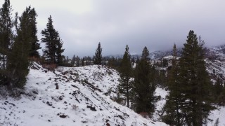 CAP_015_003 - 4K stock footage aerial video of flying low over snowy mountain slopes, Inyo National Forest, California