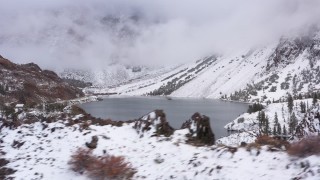 4K stock footage aerial video a view of Ellery Lake and snowy mountain slopes, Inyo National Forest, California Aerial Stock Footage | CAP_015_010