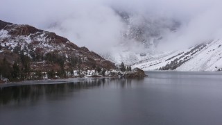 CAP_015_011 - 4K stock footage aerial video passing Ellery Lake and snowy mountain slopes, Inyo National Forest, California