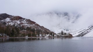 4K stock footage aerial video fly over lake toward snowy mountain slopes, Inyo National Forest, California Aerial Stock Footage | CAP_015_013