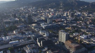 HD stock footage aerial video of flying away from the college and panning across office buildings in Hollywood, California Aerial Stock Footage | CAP_016_015