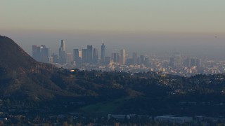 HD stock footage aerial video of a wide view of the city's skyline on a hazy day in Downtown Los Angeles, California Aerial Stock Footage | CAP_016_038