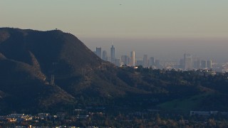 HD stock footage aerial video of a wide view of the city's skyline eclipsed by mountains, Downtown Los Angeles, California Aerial Stock Footage | CAP_016_039