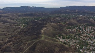 HD stock footage aerial video of flying by suburban homes and burned hills in Malibu, California Aerial Stock Footage | CAP_018_001