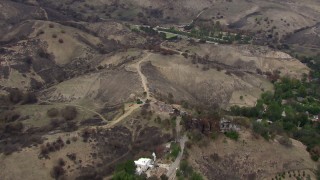 HD stock footage aerial video of flying away from homes and hills destroyed by fire, Malibu, California Aerial Stock Footage | CAP_018_007