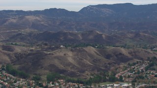 HD stock footage aerial video of a wide view of hills scarred by fire, Malibu, California Aerial Stock Footage | CAP_018_011