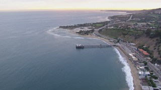 HD stock footage aerial video of flying away from Malibu Pier at sunset, California Aerial Stock Footage | CAP_018_055