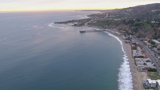 HD stock footage aerial video of flying away from neighborhoods and Malibu Pier at sunset, California Aerial Stock Footage | CAP_018_056