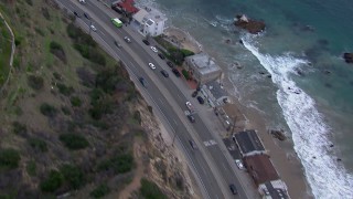 HD stock footage aerial video of light traffic on PCH at sunset and Malibu homes, California Aerial Stock Footage | CAP_018_061