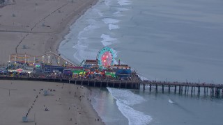 HD stock footage aerial video of orbiting the Ferris wheel at Santa Monica Pier at sunset, California Aerial Stock Footage | CAP_018_071