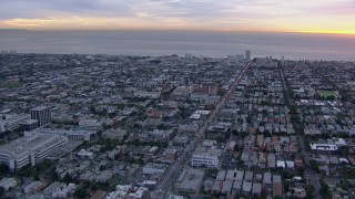 HD stock footage aerial video of a view of Santa Monica and the ocean at sunset, California Aerial Stock Footage | CAP_018_075