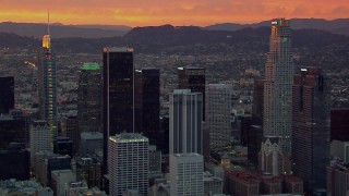 HD stock footage aerial video of flying by US Bank Tower and other Downtown Los Angeles skyscrapers at sunset, California Aerial Stock Footage | CAP_018_095