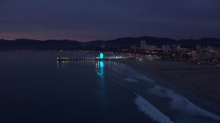 HD stock footage aerial video of slowly approaching Santa Monica Pier at twilight, California Aerial Stock Footage | CAP_018_106