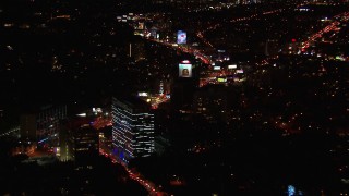 HD stock footage aerial video of approaching the Sunset Strip at night in West Hollywood, California Aerial Stock Footage | CAP_018_125