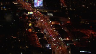 CAP_018_129 - HD stock footage aerial video of following the Sunset Strip at night in West Hollywood, California