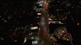 HD stock footage aerial video of following Sunset Blvd at night through Hollywood, California Aerial Stock Footage | CAP_018_134