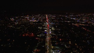 HD stock footage aerial video of following Sunset Blvd through Hollywood at night, California Aerial Stock Footage | CAP_018_136