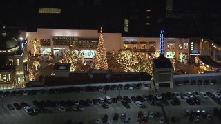 HD stock footage aerial video of orbiting a Christmas tree at The Grove shopping mall at night in Los Angeles, California Aerial Stock Footage | CAP_018_147