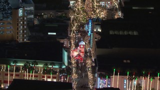 HD stock footage aerial video of holiday decorations at The Grove shopping mall at night in Los Angeles, California Aerial Stock Footage | CAP_018_160