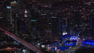 HD stock footage aerial video pan from city's skyline to Staples Center at night, Downtown Los Angeles, California Aerial Stock Footage | CAP_018_187