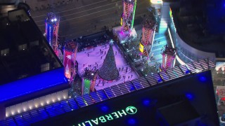 HD stock footage aerial video of orbiting an ice skating rink at night, Downtown Los Angeles, California Aerial Stock Footage | CAP_018_191