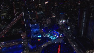 CAP_018_194 - HD stock footage aerial video orbit ice skating rink and Christmas tree by theater at night, Downtown Los Angeles, California