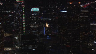 HD stock footage aerial video of zoom from rooftop Christmas tree to reveal skyscrapers, Downtown Los Angeles, California Aerial Stock Footage | CAP_018_213