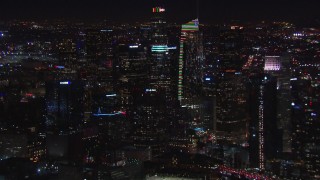 HD stock footage aerial video flying by Wilshire Grand Center and skyline at night, Downtown Los Angeles, California Aerial Stock Footage | CAP_018_218