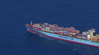 HD stock footage aerial video zoom out while tracking a cargo ship near Miami Beach, Florida Aerial Stock Footage | CAP_020_020