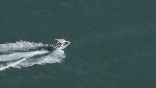 HD stock footage aerial video of tracking a boat racing across the water near Miami, Florida Aerial Stock Footage | CAP_020_036