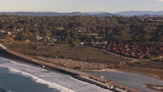 HD stock footage aerial video of flying by hillside homes by Torrey Pines Road in Del Mar, California Aerial Stock Footage | CAP_021_005