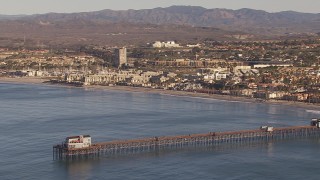 HD stock footage aerial video of orbit Oceanside Pier with view of the community of Oceanside, California Aerial Stock Footage | CAP_021_023