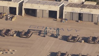 CAP_021_030 - HD stock footage aerial video of panning across military craft and hangars at Camp Pendleton South, California