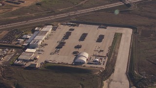 CAP_021_034 - HD stock footage aerial video of flying away from military craft at Camp Pendleton South, California