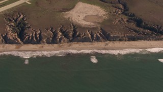 HD stock footage aerial video of an empty strip of beach and cliffs on the coast, Oceanside, California Aerial Stock Footage | CAP_021_036