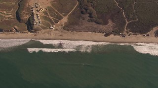 HD stock footage aerial video of passing by an empty strip of beach on the coast, Oceanside, California Aerial Stock Footage | CAP_021_038