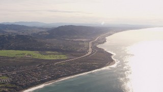 HD stock footage aerial video of a reverse view of I-5 by coastal neighborhoods in San Clemente, California Aerial Stock Footage | CAP_021_055