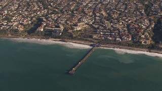 HD stock footage aerial video of orbiting a pier by coastal neighborhoods in San Clemente, California Aerial Stock Footage | CAP_021_056