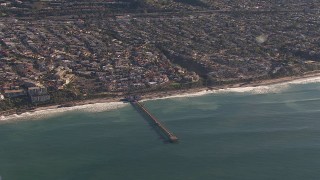 HD stock footage aerial video of flying away from a pier by coastal neighborhoods in San Clemente, California Aerial Stock Footage | CAP_021_057