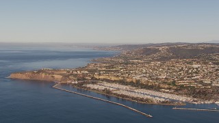 HD stock footage aerial video of flying toward the harbor and coastal neighborhoods in Dana Point, California Aerial Stock Footage | CAP_021_060