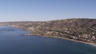 HD stock footage aerial video approach hillside homes and coastal neighborhoods in Laguna Beach, California Aerial Stock Footage | CAP_021_067