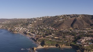 CAP_021_068 - HD stock footage aerial video flying by hillside homes and coastal neighborhoods in Laguna Beach, California