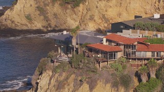 HD stock footage aerial video of orbiting clifftop mansions overlooking the ocean, Laguna Beach, California Aerial Stock Footage | CAP_021_072