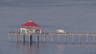 HD stock footage aerial video truck backing up to diner on a pier, Huntington Beach, California Aerial Stock Footage | CAP_021_079