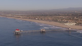 HD stock footage aerial video of flying toward a diner on a pier, Huntington Beach, California Aerial Stock Footage | CAP_021_081