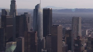 HD stock footage aerial video zoom in on Wilshire Grand Center skyscraper, Downtown Los Angeles, California Aerial Stock Footage | CAP_021_101