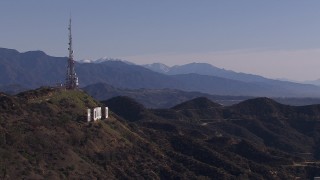 HD stock footage aerial video of the famous Hollywood Sign and distant mountains, Los Angeles, California Aerial Stock Footage | CAP_021_121