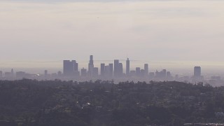 HD stock footage aerial video of a wide view of the city's skyline on a hazy day, seen from Hollywood Hills, Downtown Los Angeles, California Aerial Stock Footage | CAP_021_128