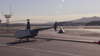 CAP_021_137 - HD stock footage aerial video of passing civilian jets and helicopters by a Burbank Airport hangar, California