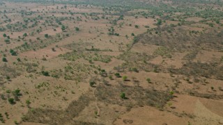 CAP_026_011 - HD stock footage aerial video of flying above open savanna, Zimbabwe